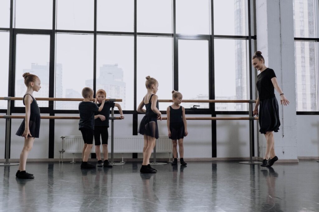 A Ballet Dancer Teaching Girls